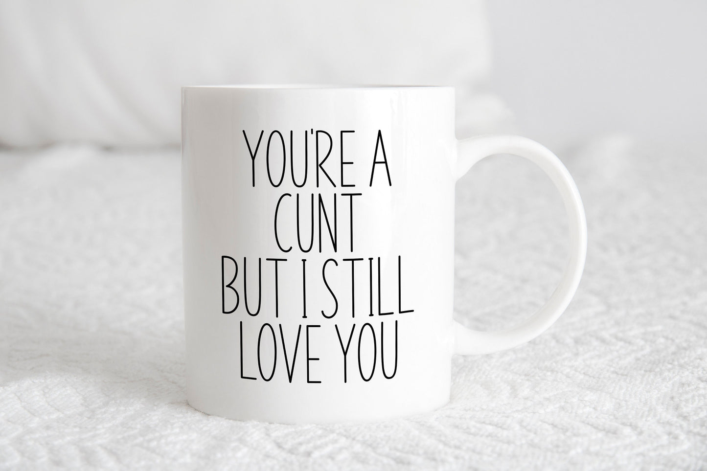 A white ceramic mug with the text 'You're a cunt but I still love you' printed on it.
A lovely secret Santa gift