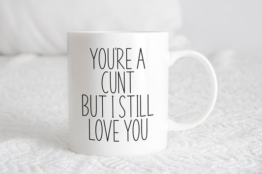 A white ceramic mug with the text 'You're a cunt but I still love you' printed on it.
A lovely secret Santa gift